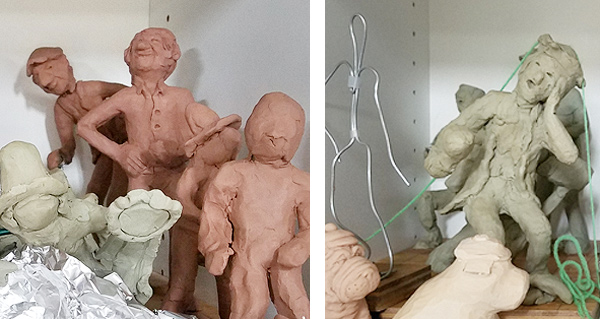 An assortment of rough clay models of figurines, and wire armatures and aluminum foil wads. The models are all posed: one suggesting surprise, one appearing pleased and triumphant, and one bending to peer around the others.