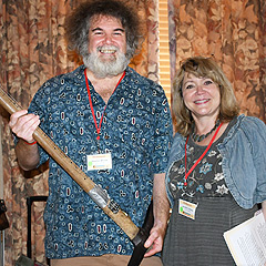 Stephen Winick and Jennifer Cutting of the Library of Congress’s American Folklife Center pose with a guitar made from a miner’s pick-axe 