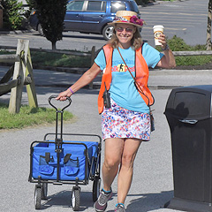Uber-volunteer Jess Hayden comes into the festival area with a wagon and a cup of coffee