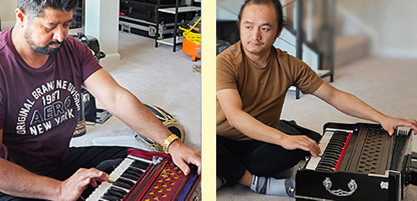 Two men playing harmonium: Apprentice Bhagirath Khatiwada (left) and Master Muskan Balampaki Mugar