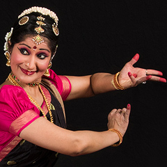 Rachita Nambiar gestures with both hands in a classical South Indian dance