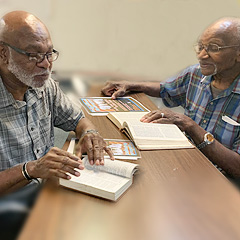 Anthony Jackson (left) studies with Rev. Moses Jackson
