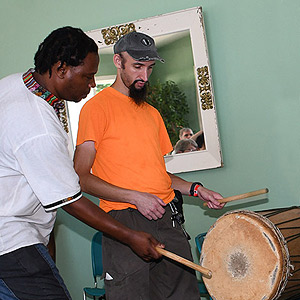 teacher and participant at drum workshop